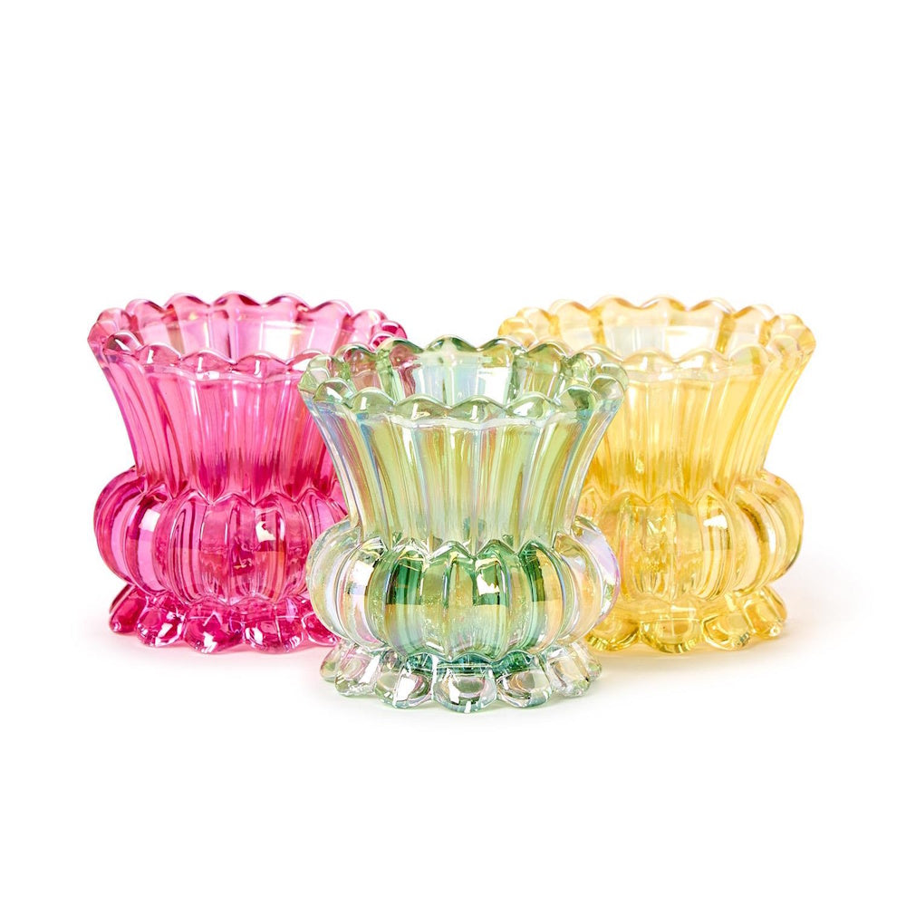 Three small, scalloped iridescent glass vases in pink, light green, and yellow, set against a white background.
