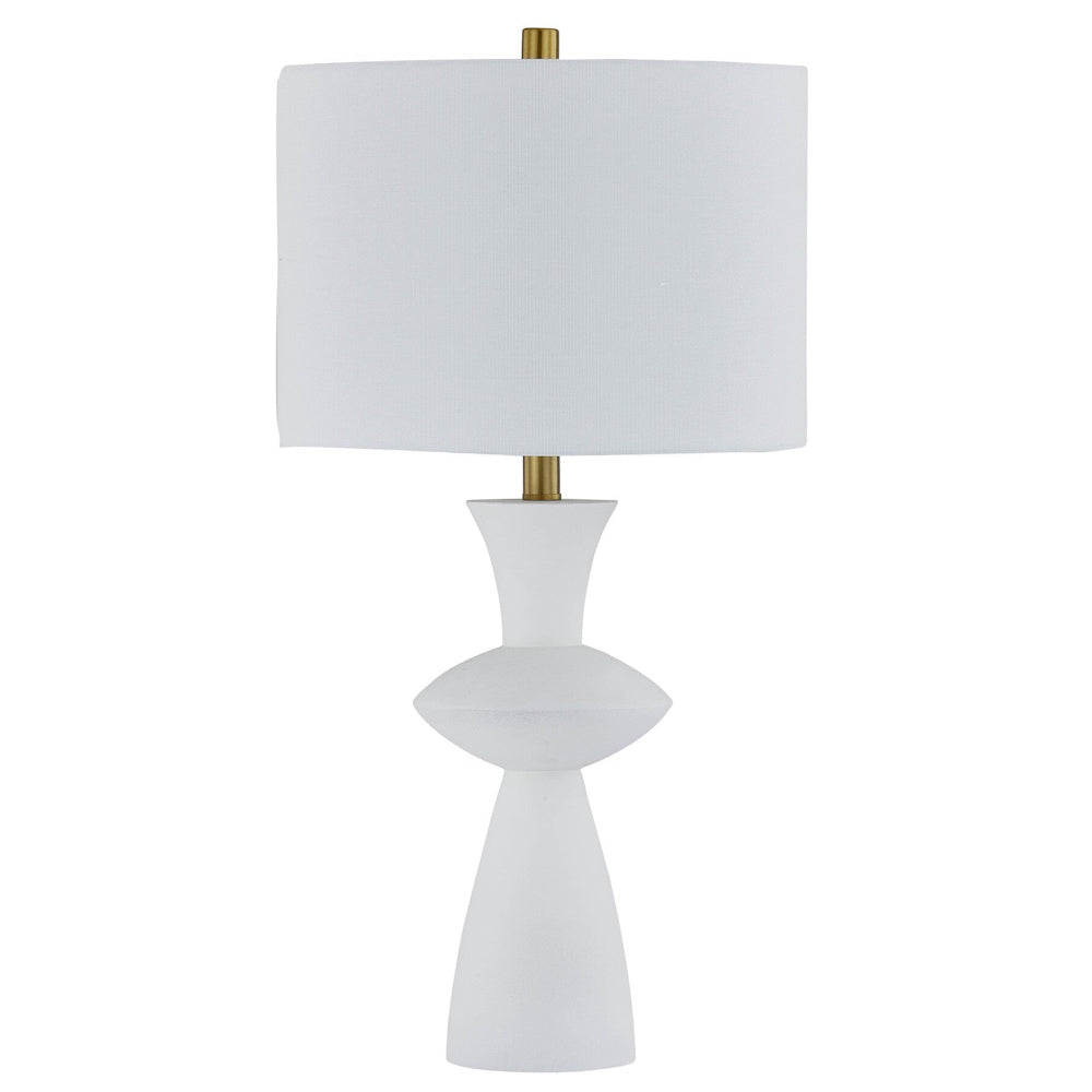 Modern white sculptural table lamp with a white drum shade and gold accents on a white background.