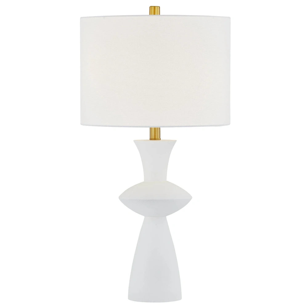 Modern white sculptural table lamp with a white drum shade and gold accents on a white background.