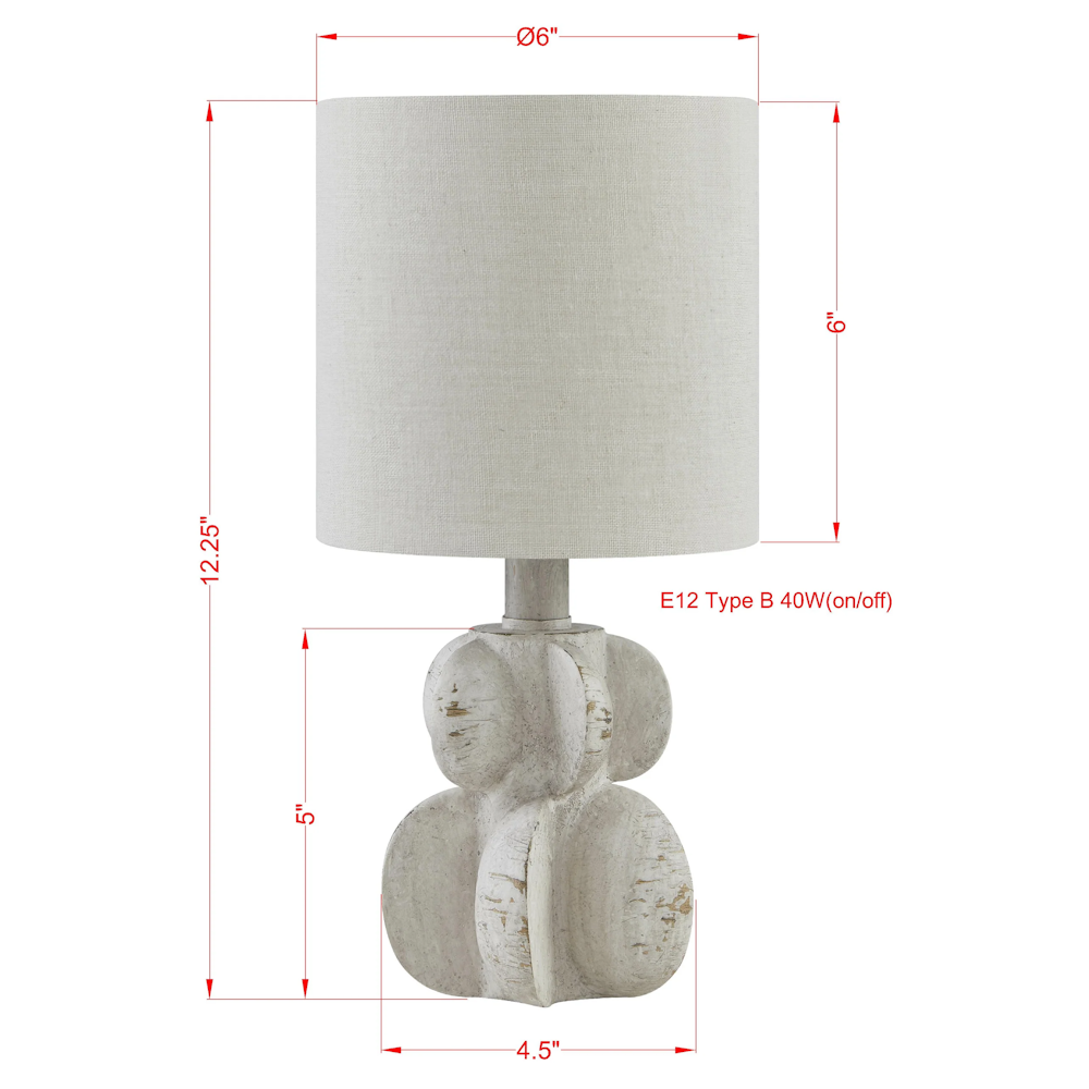 White sculptural table lamp with a 6-inch linen drum shade and a distressed cream finish, 12.25 inches tall.