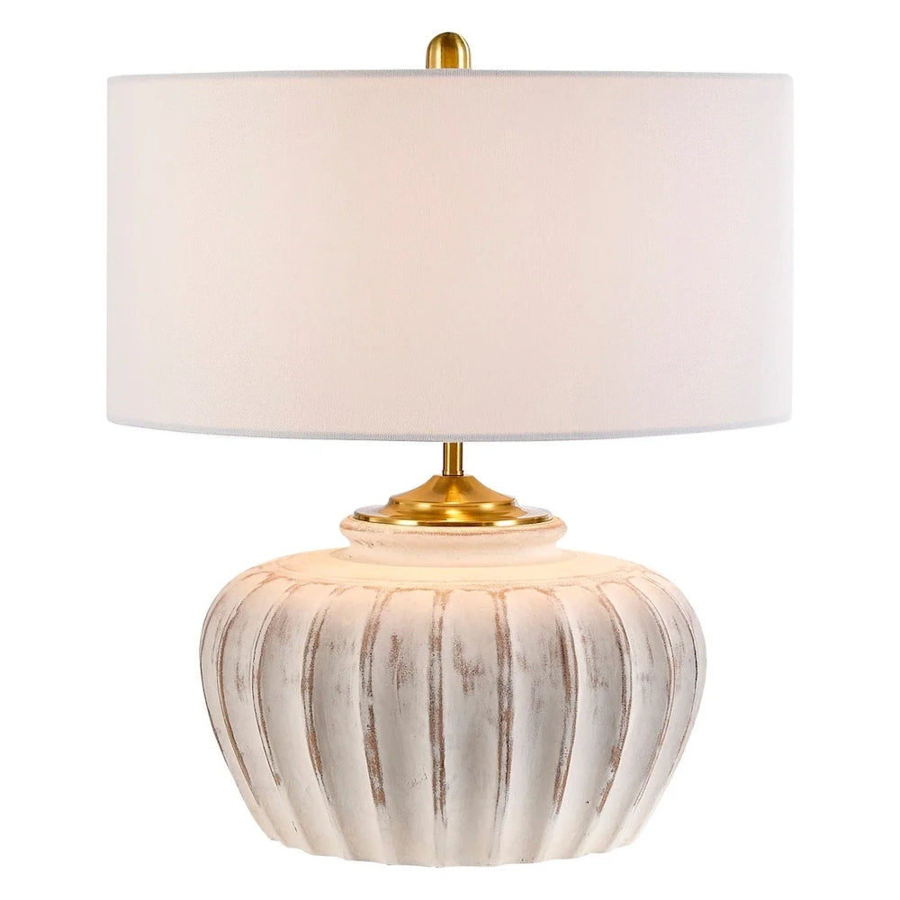 Rustic ribbed ceramic table lamp with white fabric drum shade and gold metal accents.