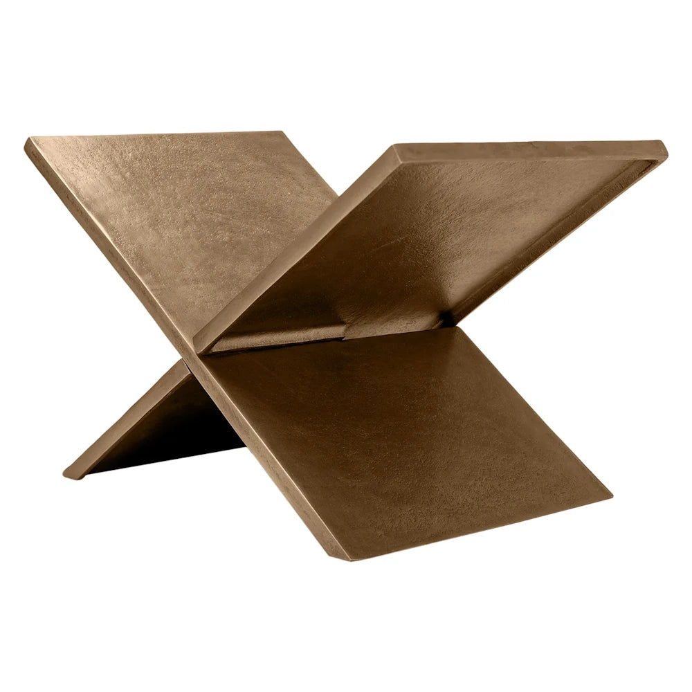 An X-shaped, bronze-colored metal book holder with a textured finish, designed to display an open book.