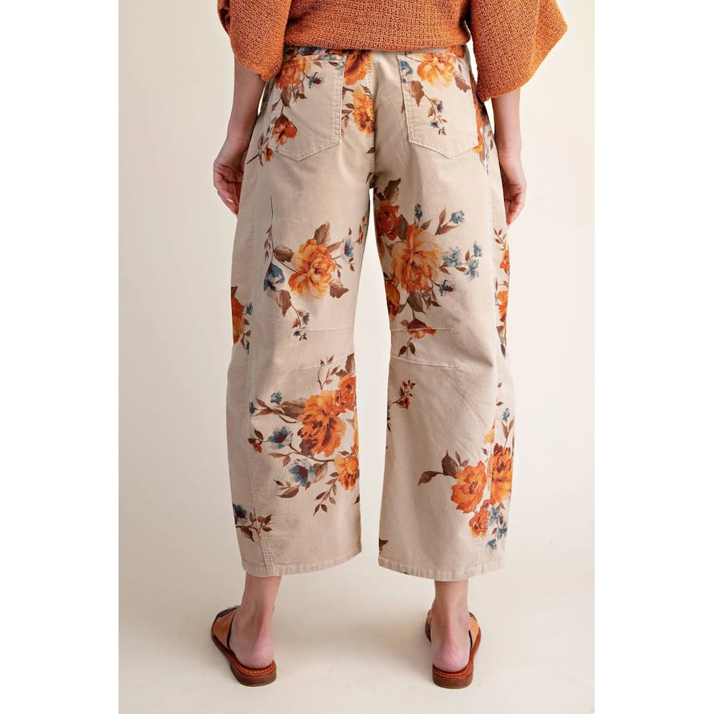 Khaki washed corduroy barrel pants with an orange and blue floral print, shown from the back.
