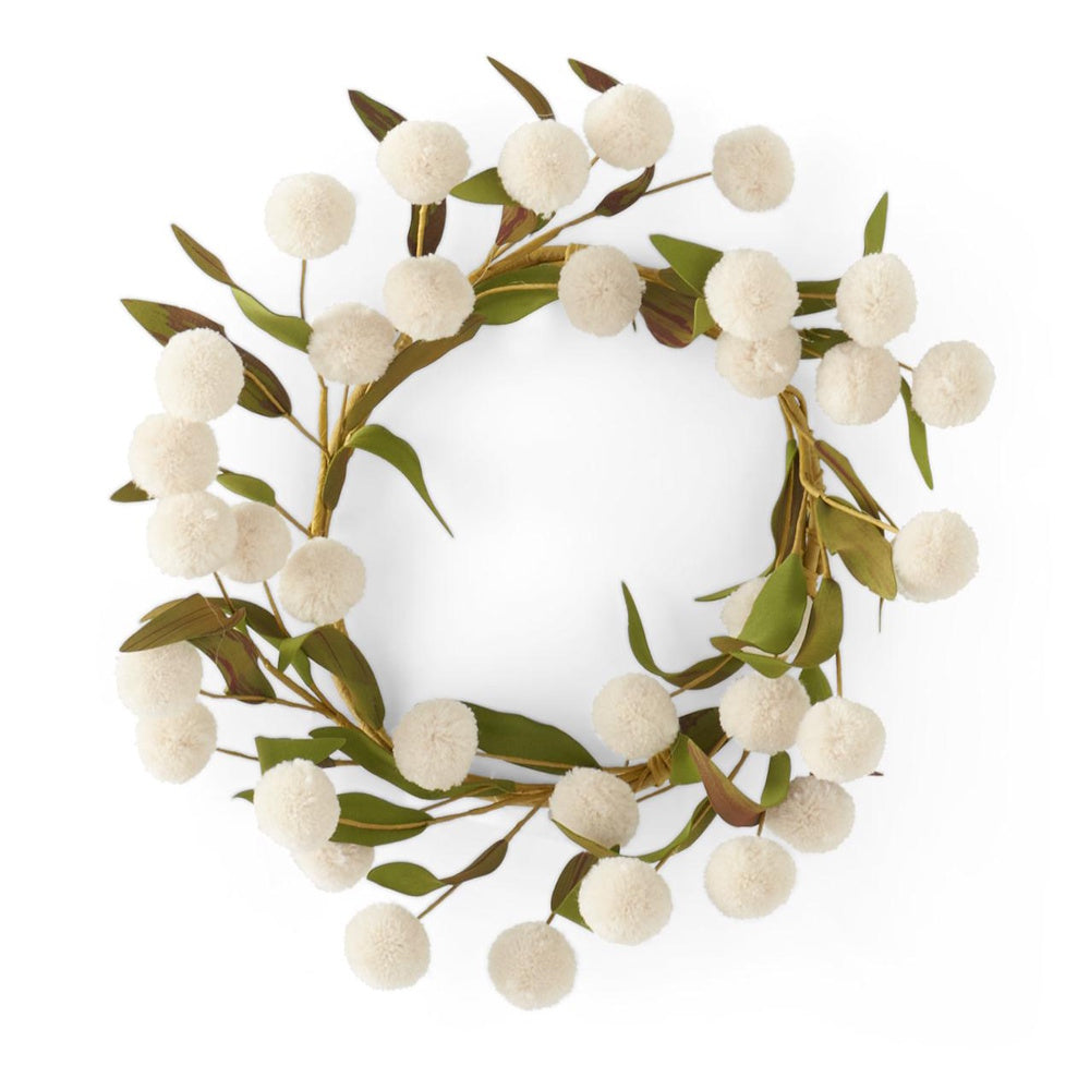 A circular candle ring wreath featuring green leaves and white fluffy pom-poms on a white background.