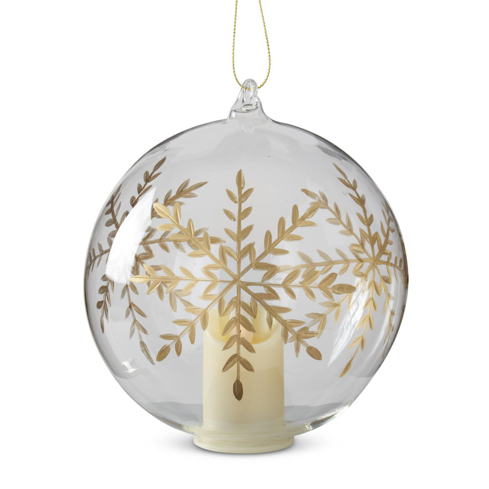 Large LED clear glass spherical ornament with a gold-gilded etched snowflake design and internal candle.