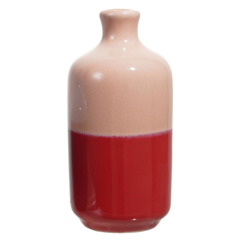 A two-tone ceramic vase with a light pink upper half and a glossy red lower half on white background.