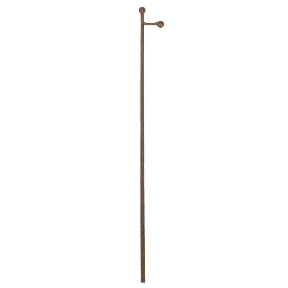 Front view of a large rust metal charm display stake with a side arm.