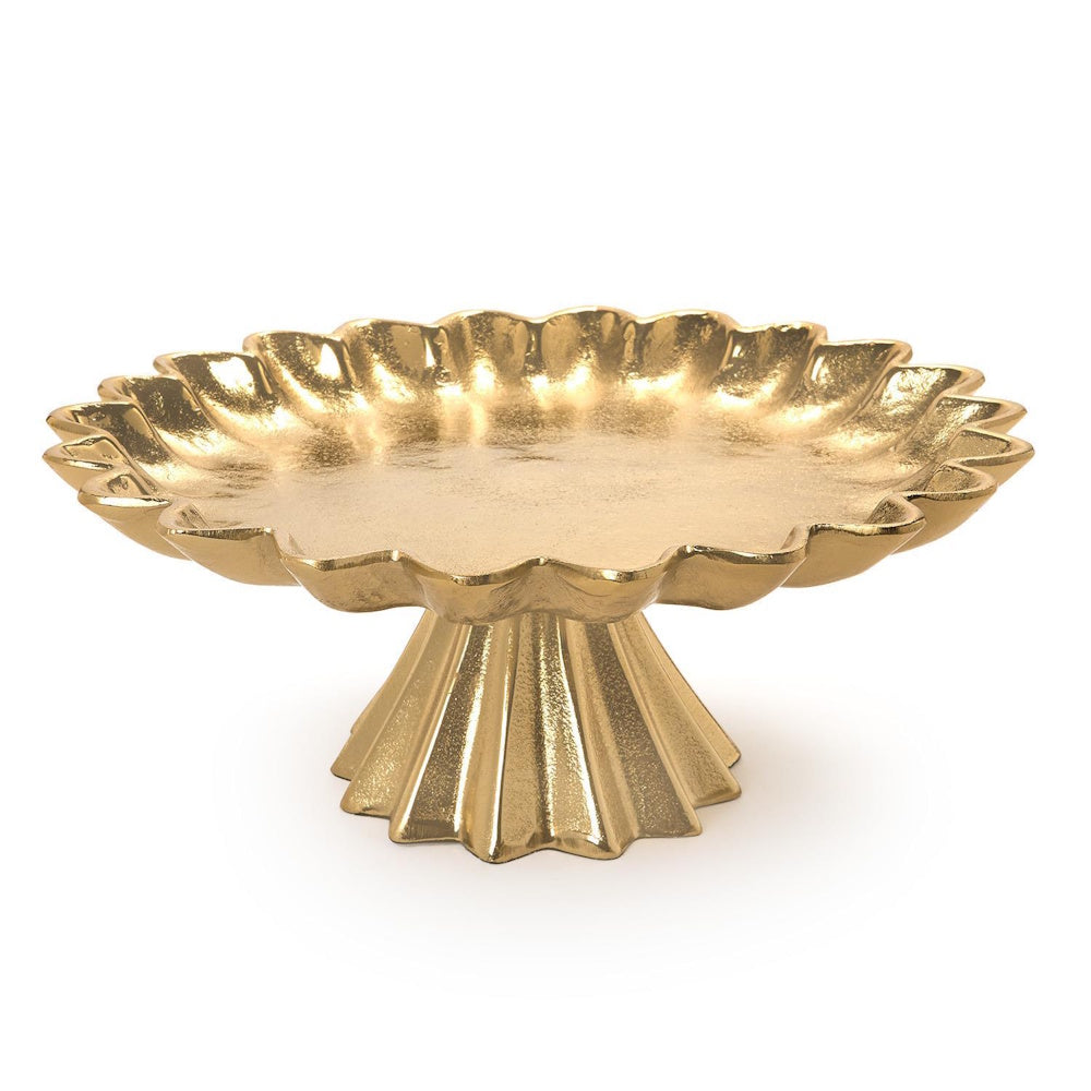 Gold cake stand with a scalloped-edge plate and fluted pedestal base set against a plain white background.