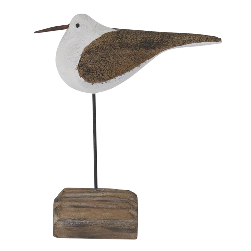 Handcrafted wooden seagull figurine on a driftwood base, nautical beach house decor on a white background.