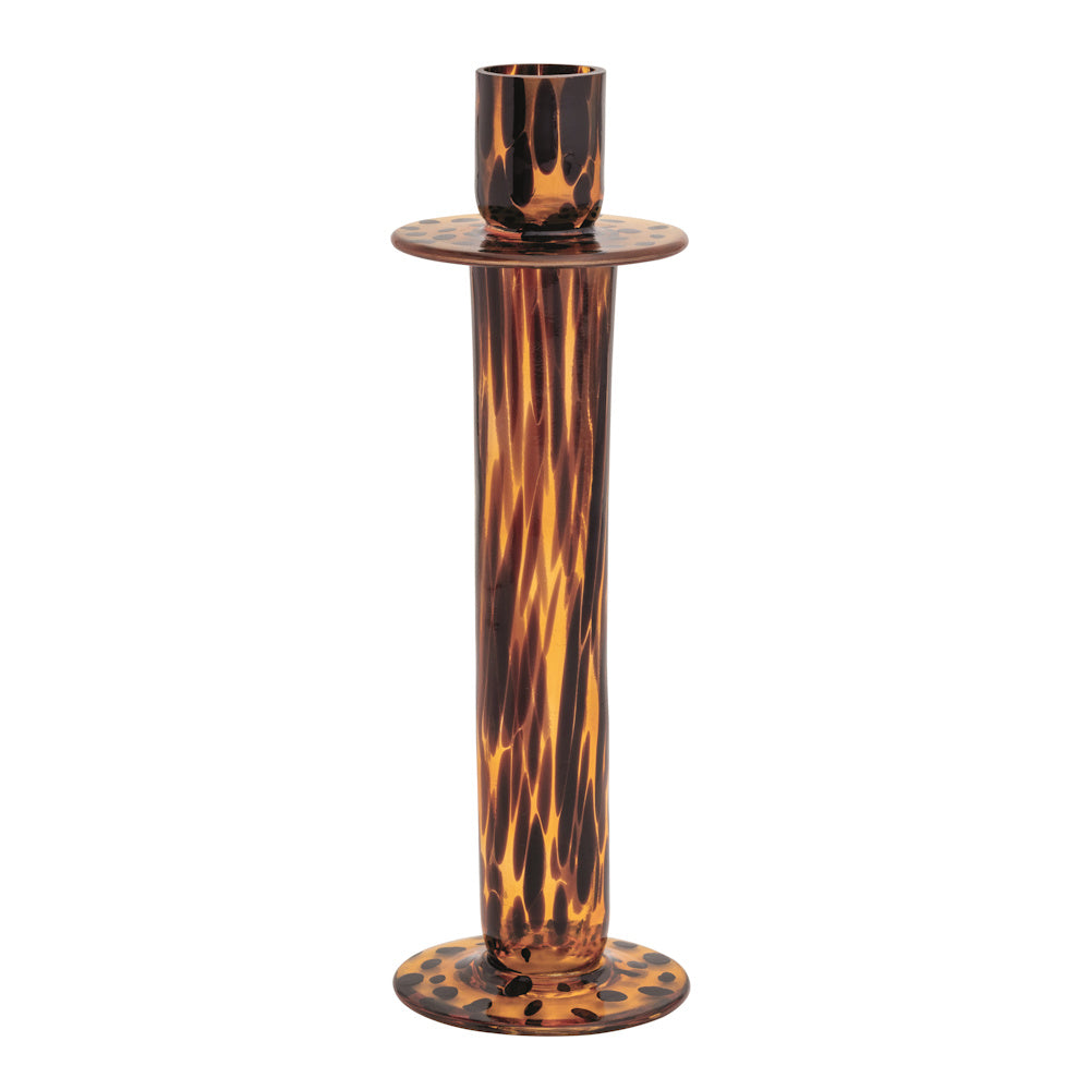 Tall tortoiseshell glass taper candle holder with a slender amber and brown dappled neck on a white background.