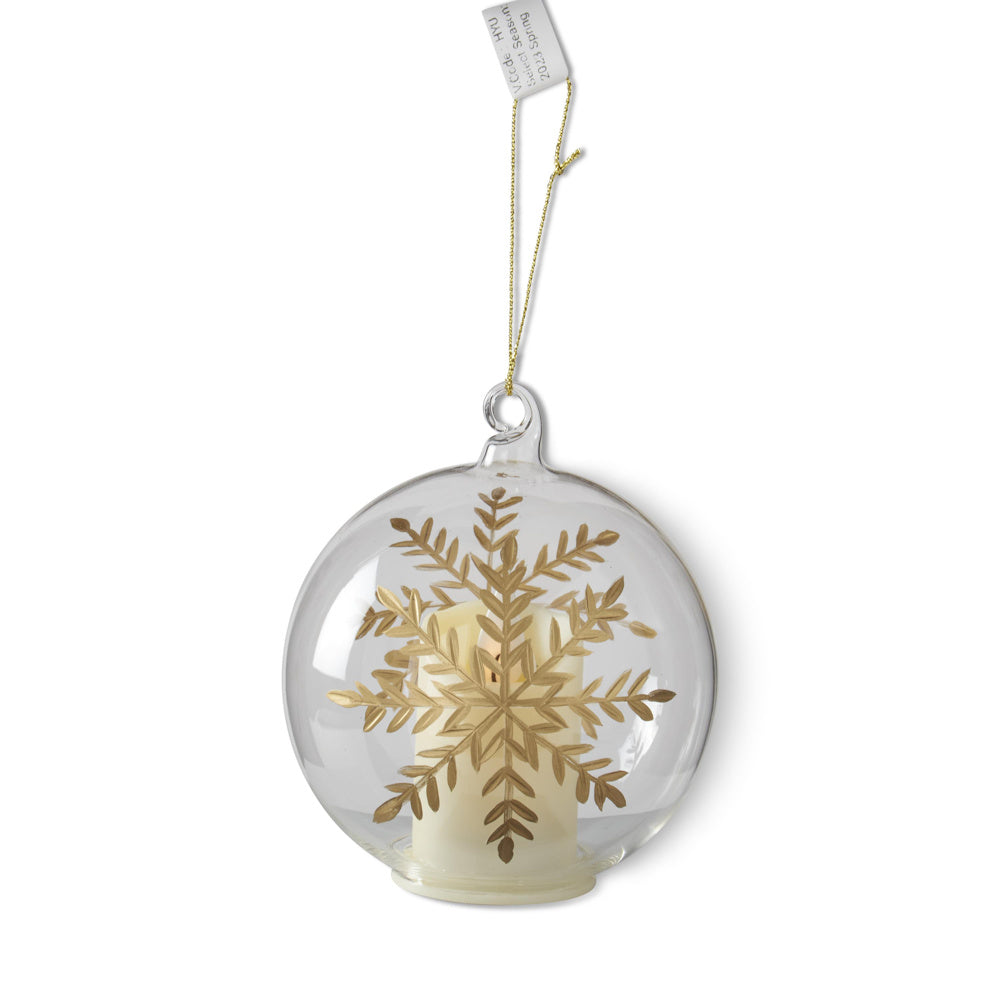 LED clear glass spherical ornament with gold-gilded etched snowflake, internal candle, and hanging tag.