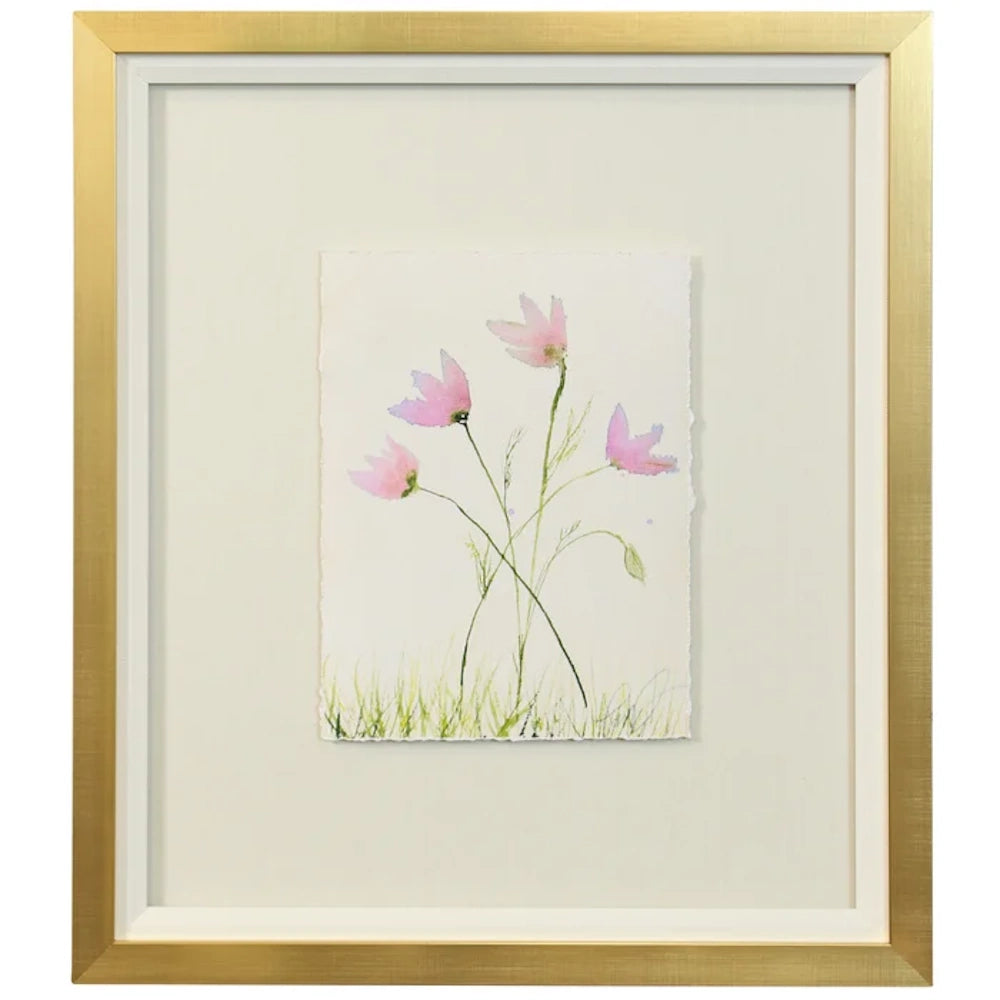 A gold-framed watercolor print on paper featuring four delicate pink blossoms and green grass.