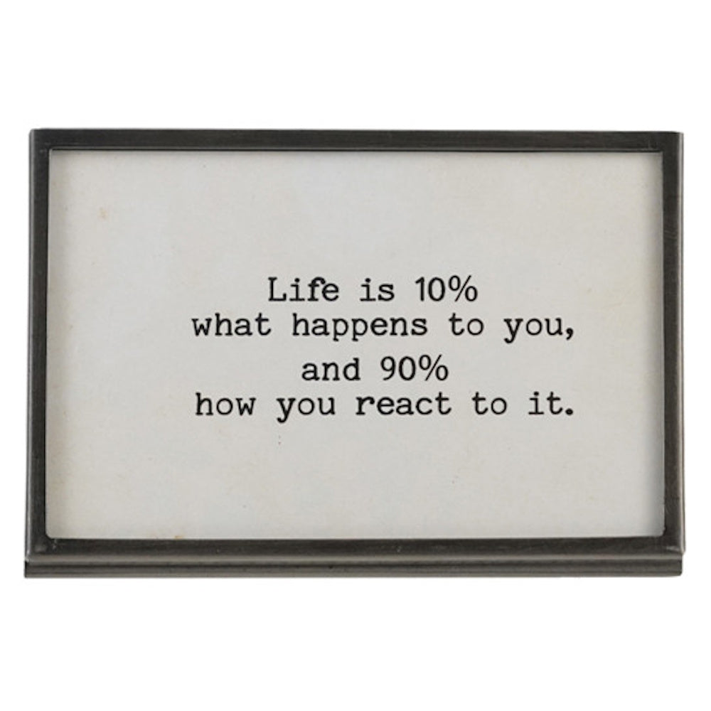 Gunmetal finish metal and glass frame with an easel back featuring the quote "Life is 10% what happens to you, and 90% how you react to it."