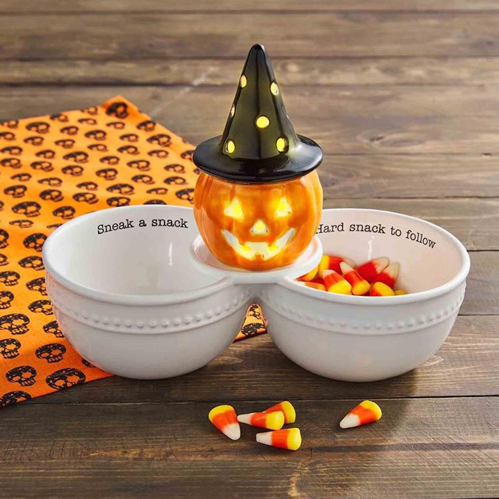 Light-up ceramic witch pumpkin jack-o'-lantern Halloween double candy bowl filled with candy corn.