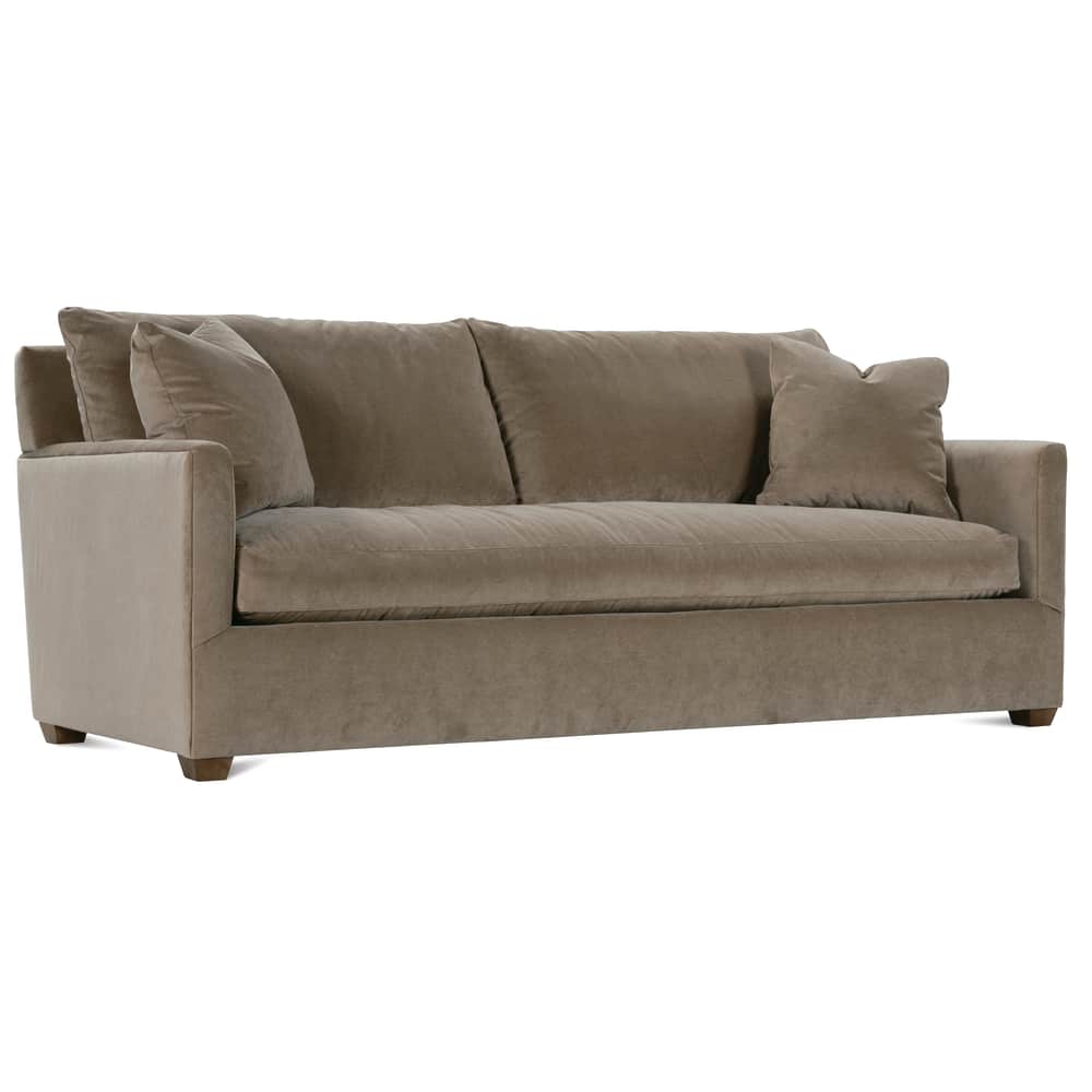 Modern taupe velvet sofa with plush cushions and throw pillows.