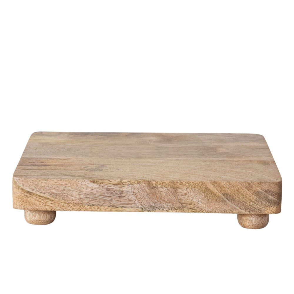 Rectangular mango wood footed cheese serving board with short rounded feet.