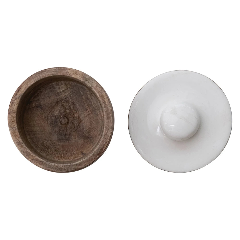 Top view of an empty rustic wooden bowl next to its white marble lid on a white background.