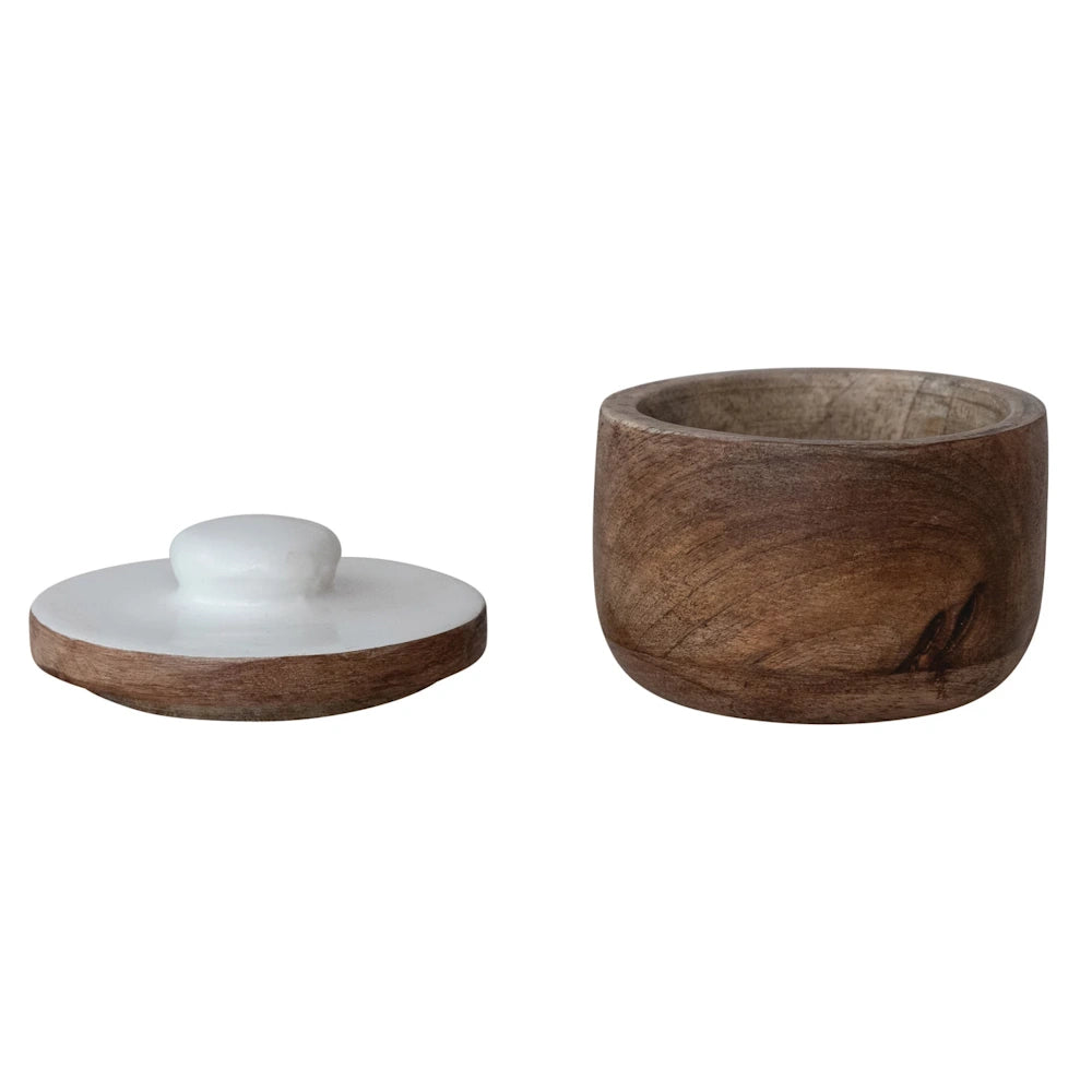 Small round wooden salt cellar with a white ceramic lid, hand-carved acacia wood spice bowl for kitchen storage.
