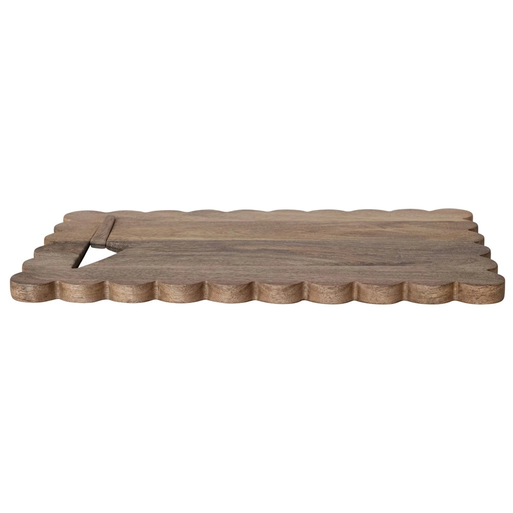 Rustic scalloped wood cheese board and decorative tray with natural grain finish on white background.