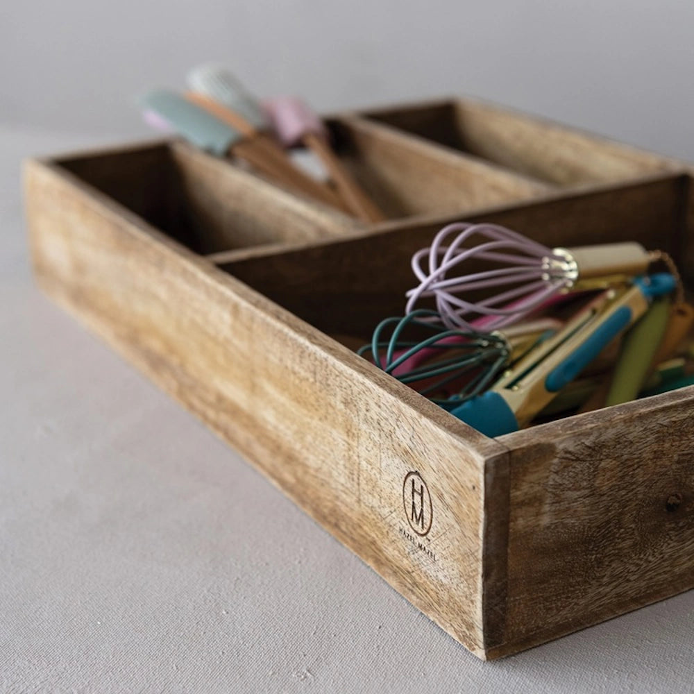 Hazel Mazel 4 section mango wood tray organizer filled with colorful kitchen utensils.