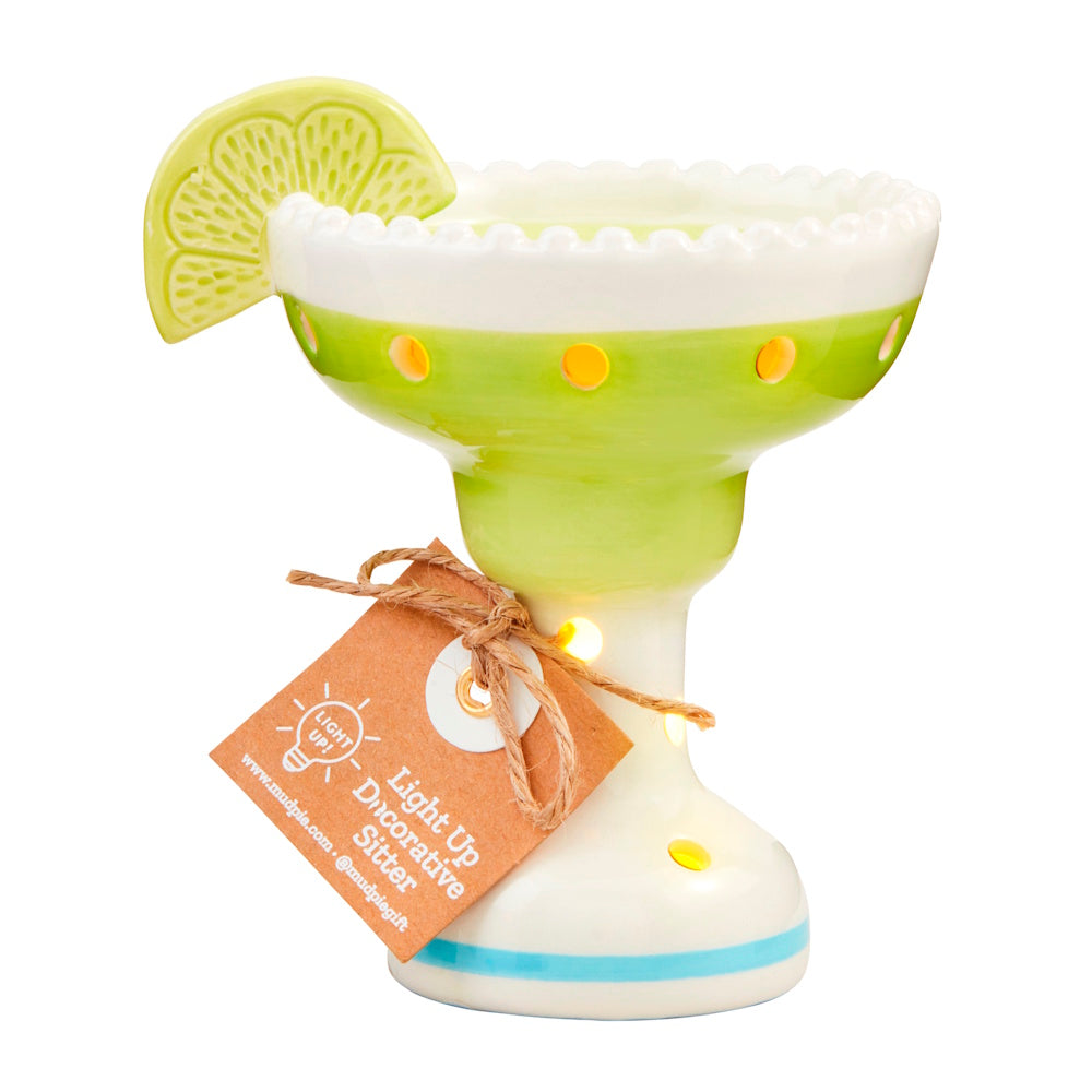 Ceramic margarita glass light-up decorative sitter with a lime slice garnish and green and white glazed finish.