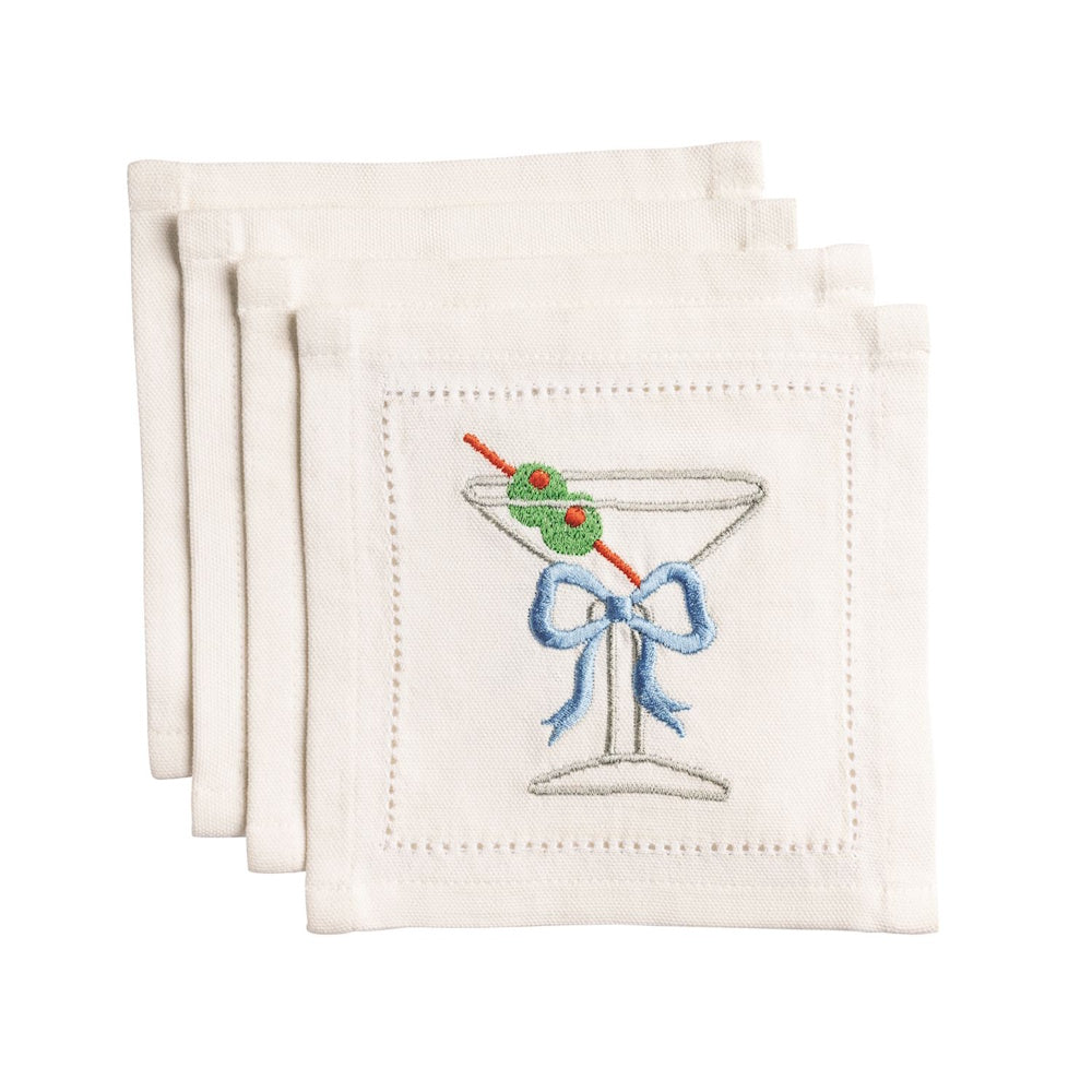Set of 4 white linen cocktail napkins with an embroidered martini glass, blue bow, and olives on a skewer.