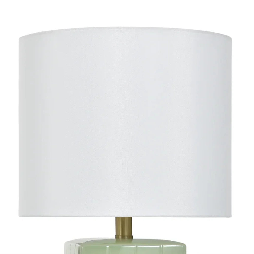 Close-up of a Matilda mint ceramic accent lamp featuring a white drum shade and a gold-finished neck.
