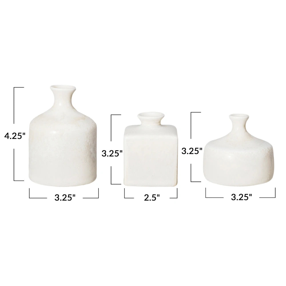 Three white ceramic vases in varied shapes shown with height and width measurement labels in inches.