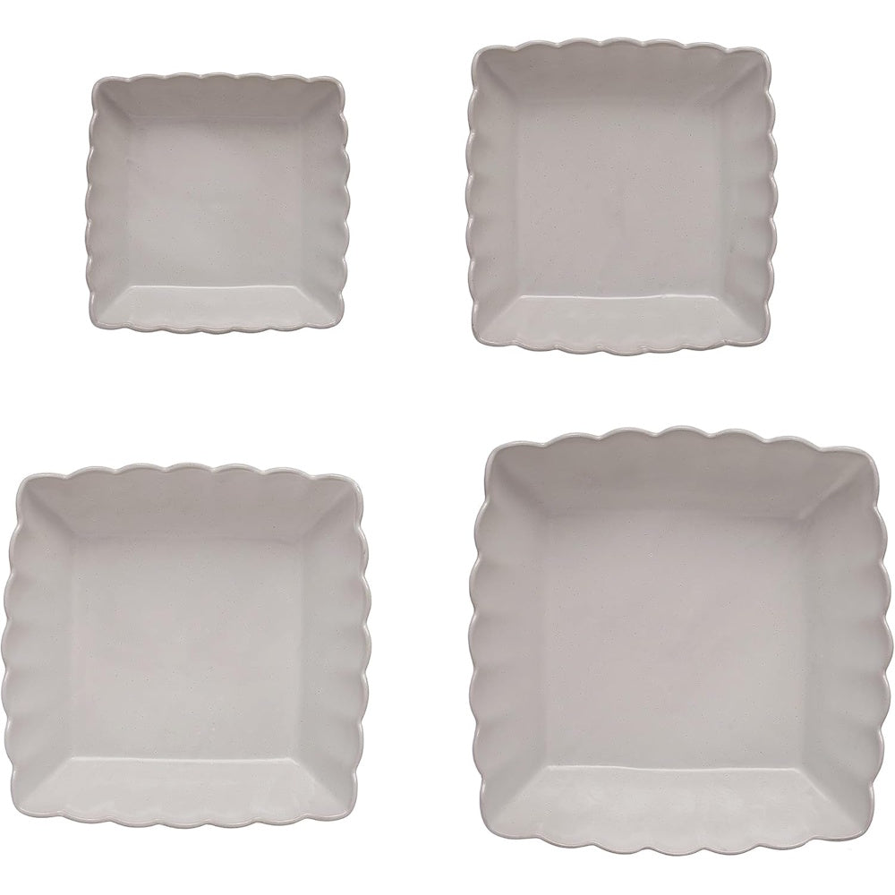 Set of 4 matte white square stoneware nesting bowls featuring wavy scalloped edges, viewed from above.