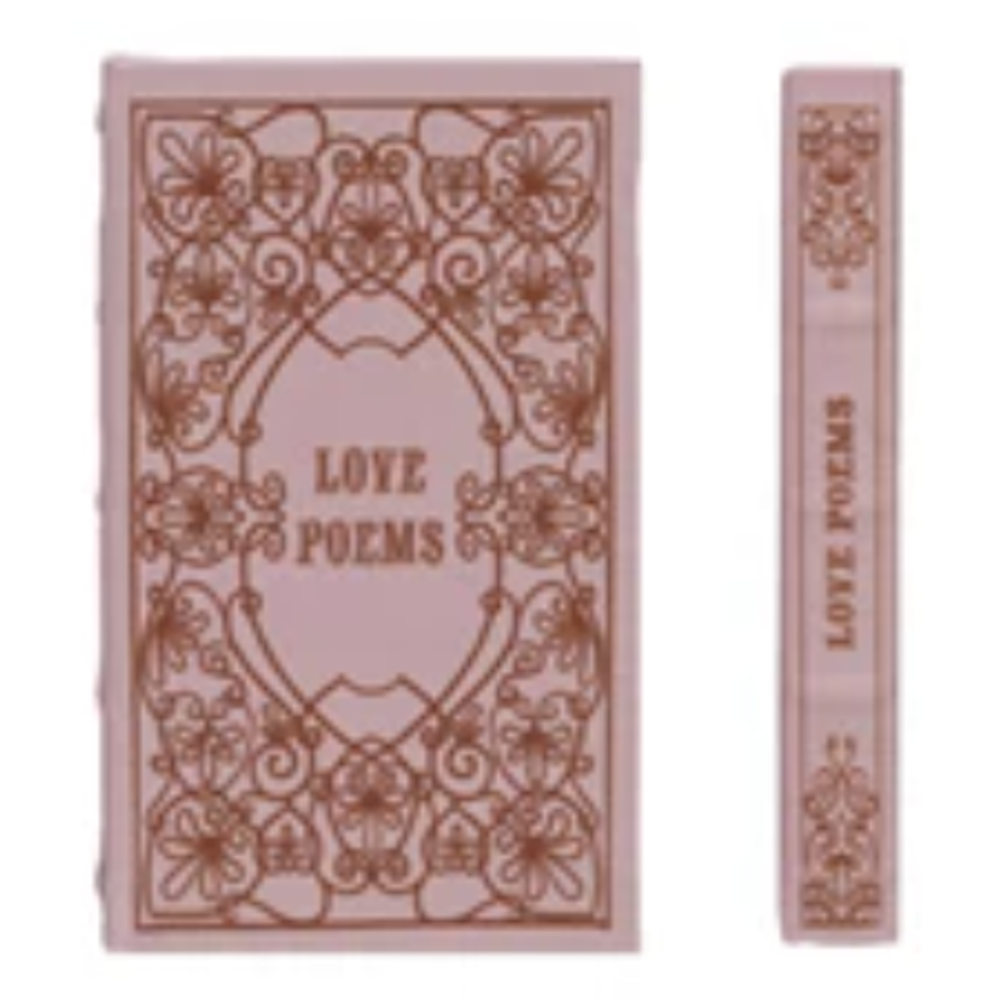 Pink Love Poems vintage book with ornate gold filigree design on front cover and spine, isolated on white background.