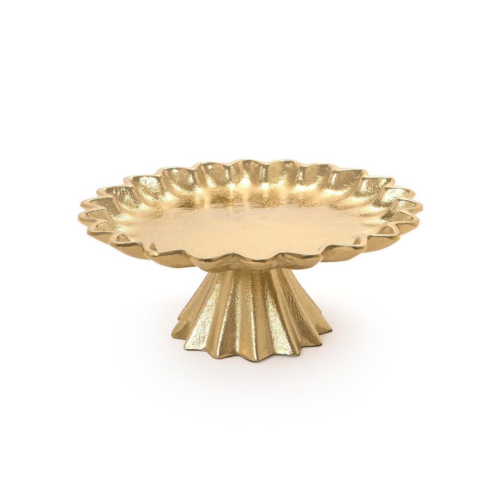 Gold cake stand with a textured scalloped rim and flared pedestal base against a clean white background.