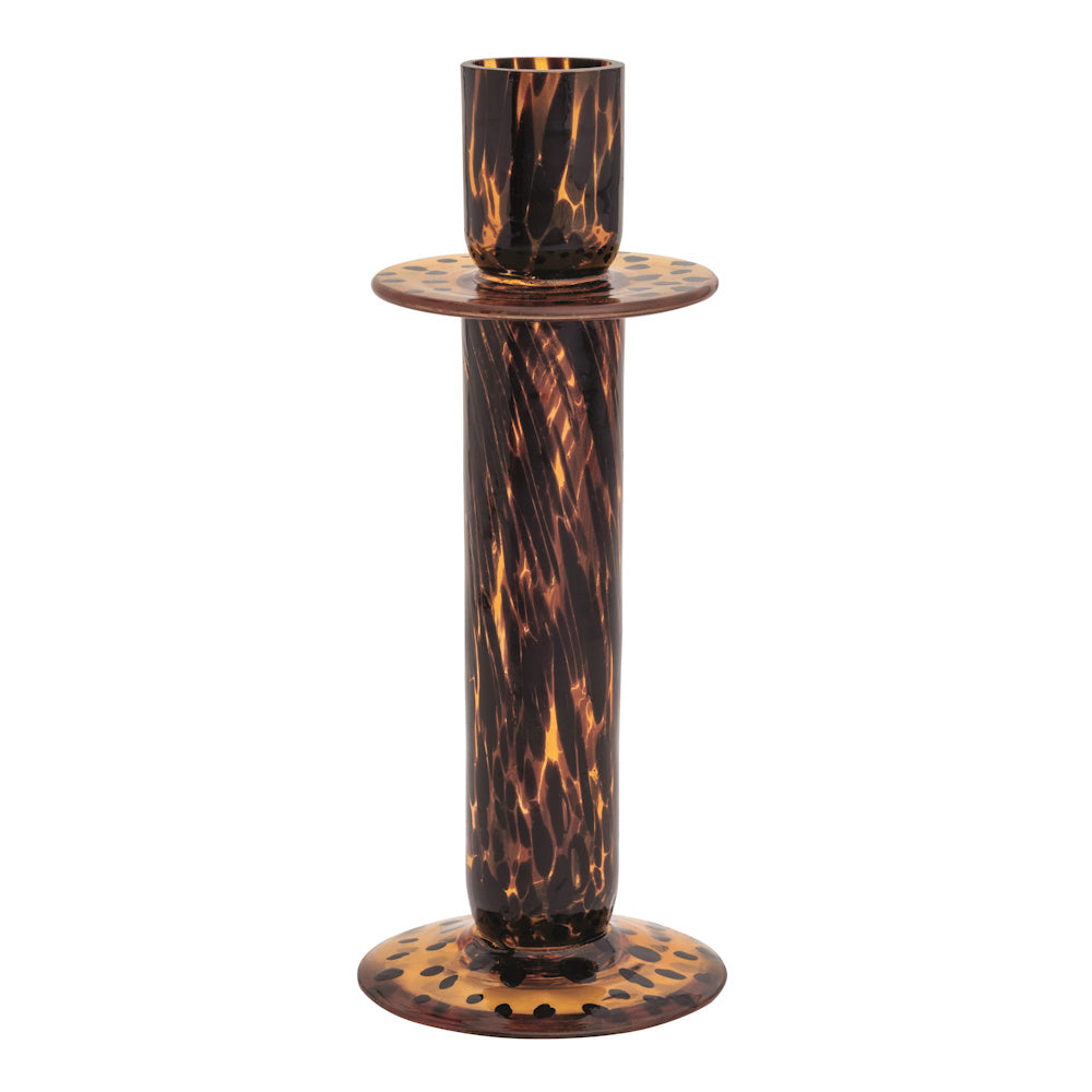 Elegant tortoise shell glass candlestick holder with amber and dark brown leopard print patterns on a white background.