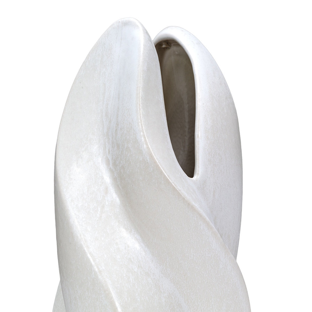 Close-up of a white Merlin ceramic vase featuring a modern, sculpted twist design and smooth, textured matte finish.