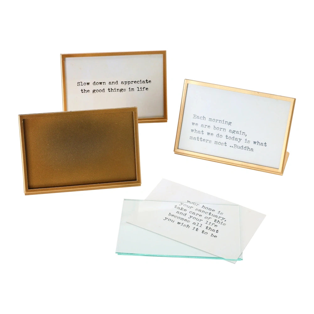 Set of 3 gold metal and glass easel picture frames with typewriter-style inspirational quotes and glass inserts.