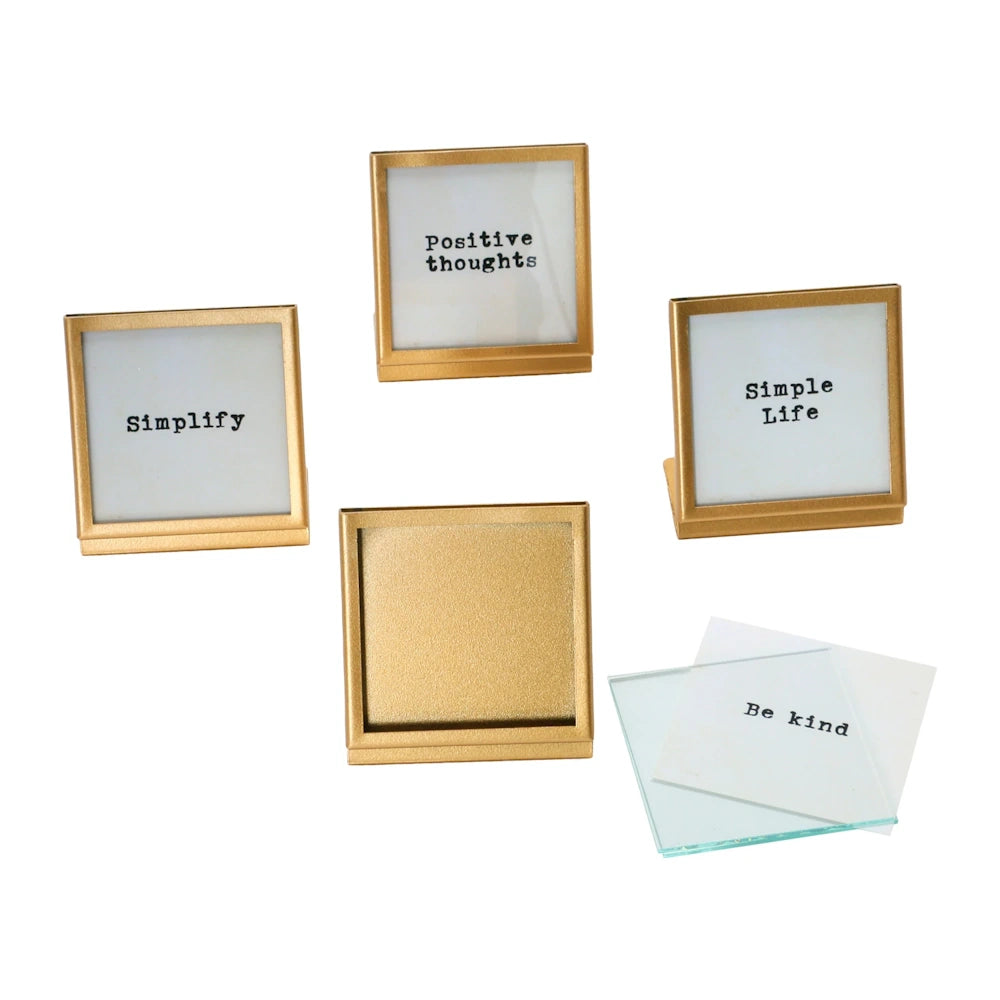 Set of 4 square gold metal and glass easel picture frames with inspirational quotes like Simplify and Positive Thoughts.
