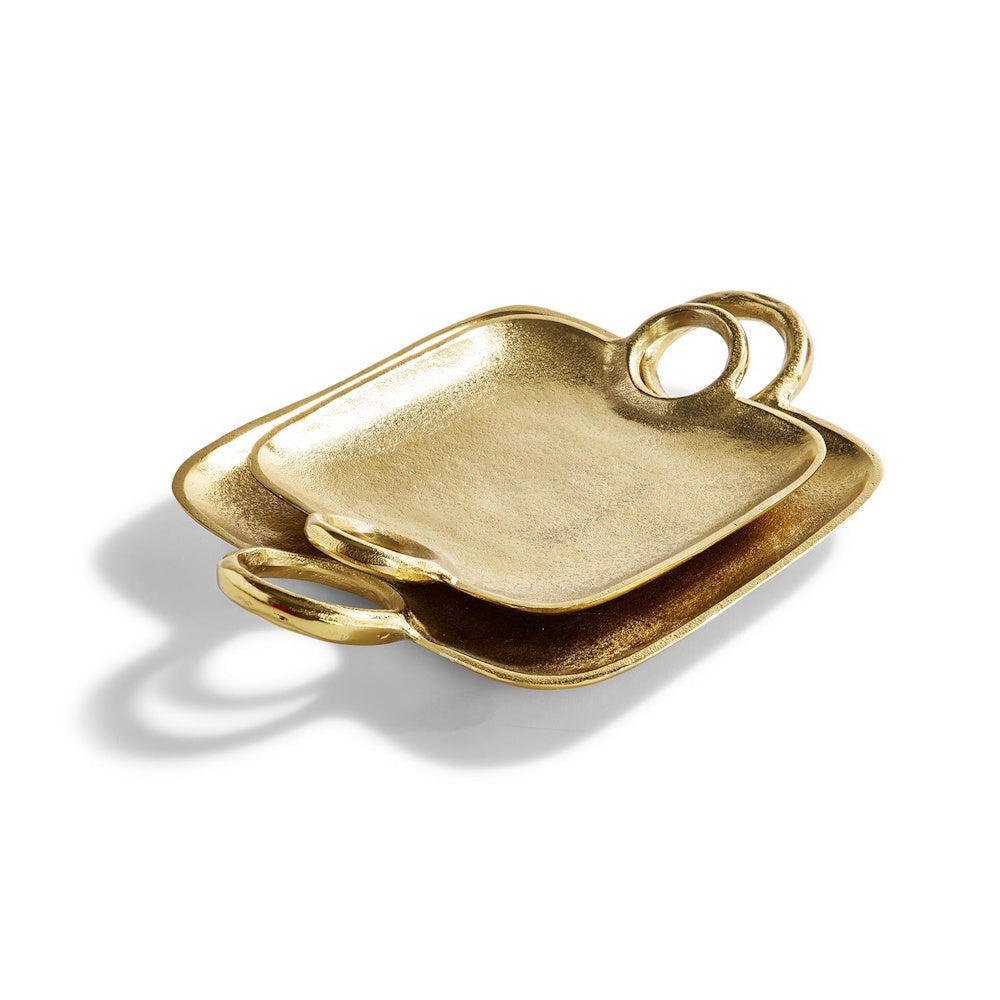 Set of two gold metallic trays with loop handles stacked on a white background.