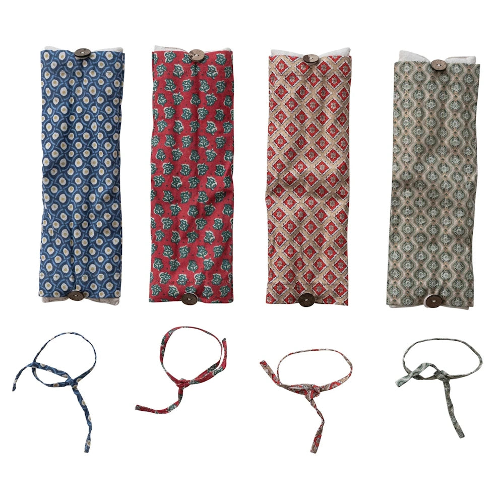 Microwavable lavender hot and cold packs in four patterned fabric covers with matching ties for natural pain relief.