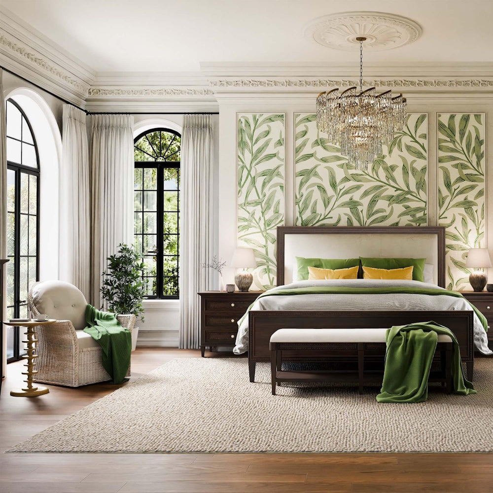 Milano round side table in gold next to an armchair in a luxurious bedroom.