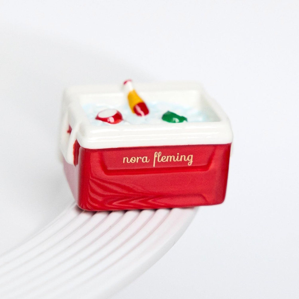 Ceramic Nora Fleming Ice Cold Cooler mini featuring a red base, white lid, and colorful drink bottles in ice.