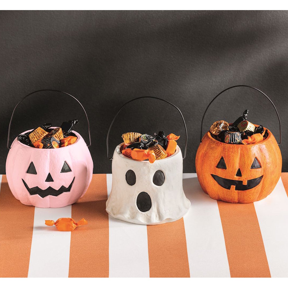 Mini paper-mache Halloween candy buckets with a pink pumpkin, white ghost, and orange jack-o'-lantern.