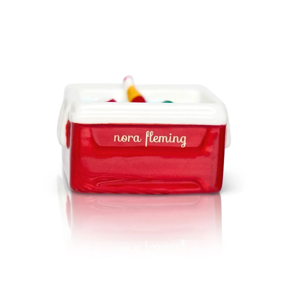 Red and white Nora Fleming ice cold cooler mini featuring colorful beverage bottles tucked inside.