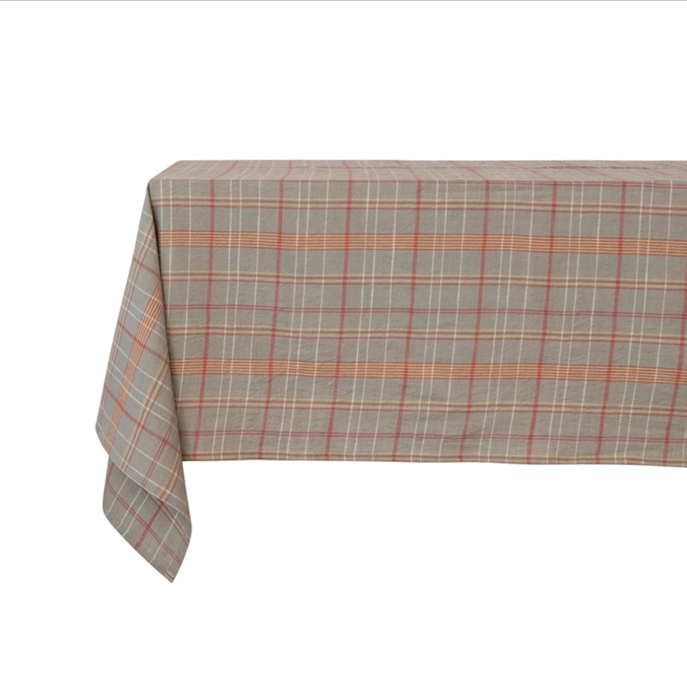 Beige plaid woven cotton tablecloth with subtle orange, pink, and white grid lines.