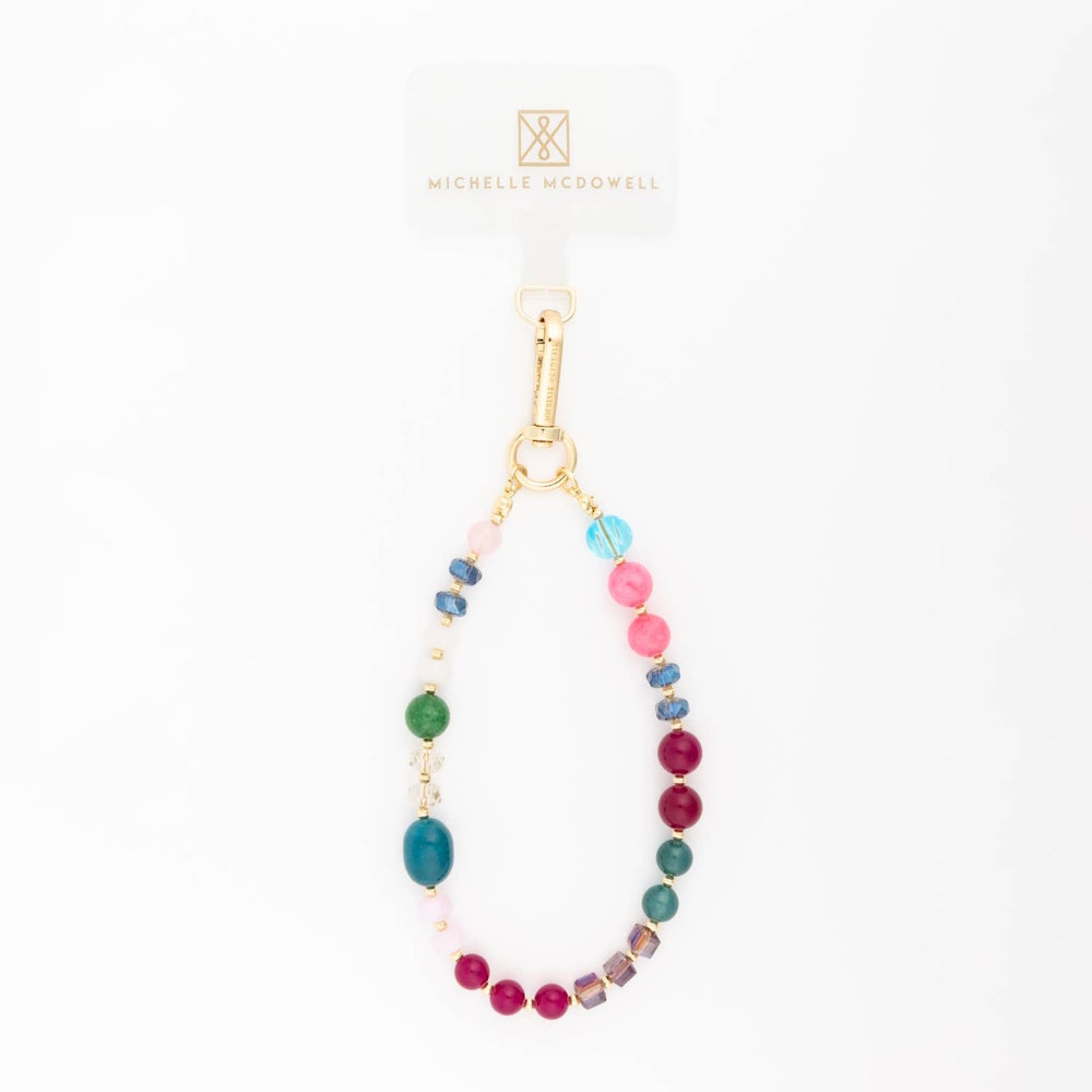 Multicolor beaded phone charm strap with gold hardware on a plain white background.