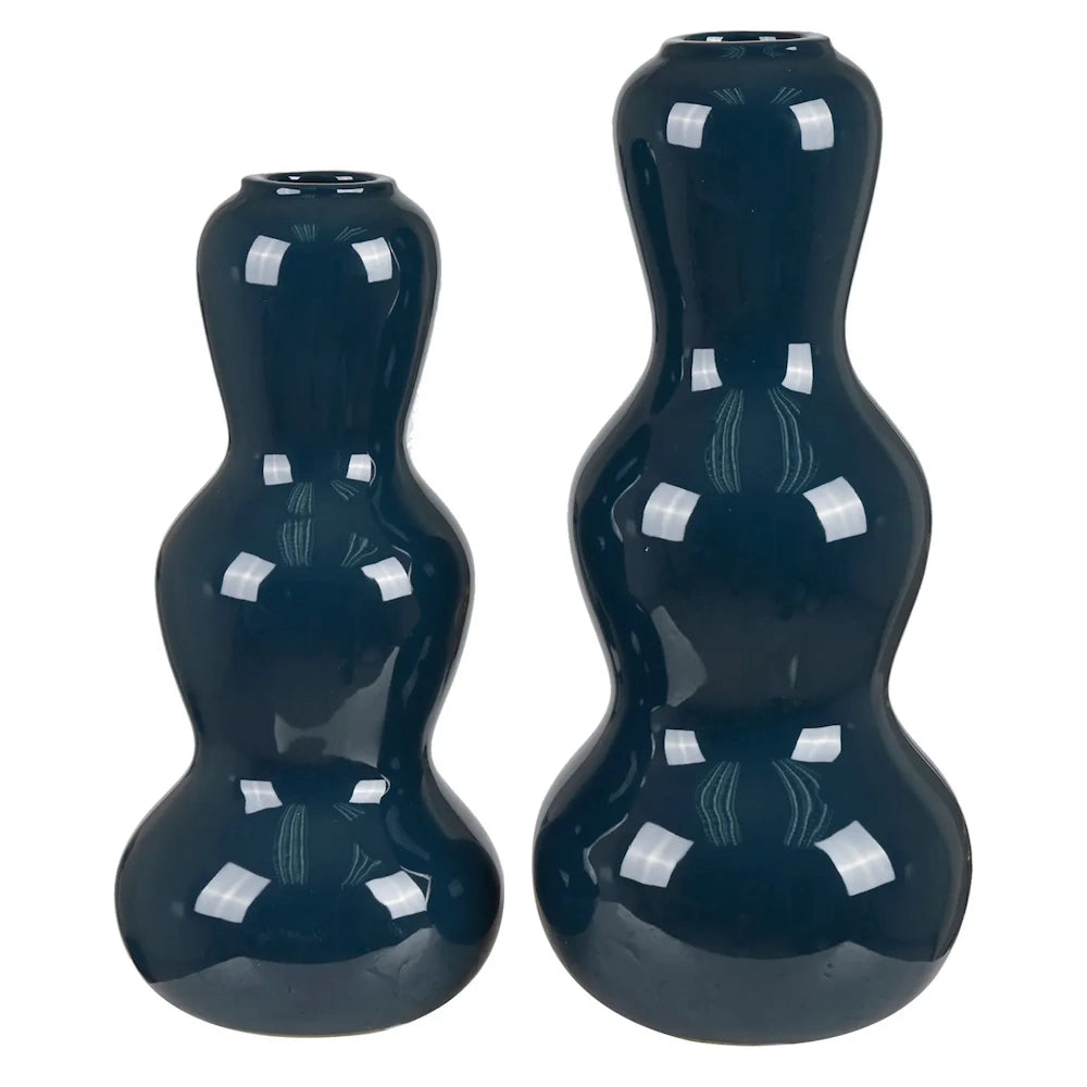 Pair of glossy navy blue ceramic gourd vases in different sizes on a white background.
