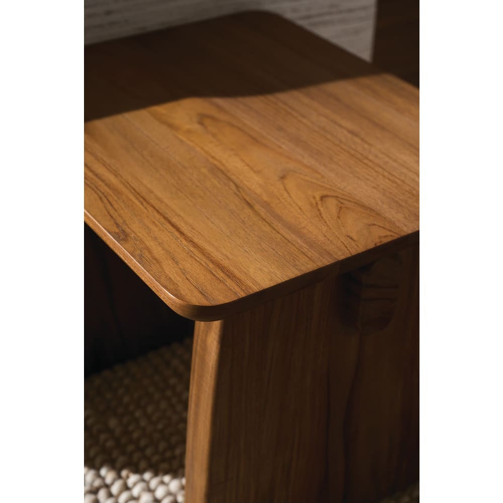 Close up of modern walnut end table showcasing rounded tabletop corners and rich natural wood grain detail.