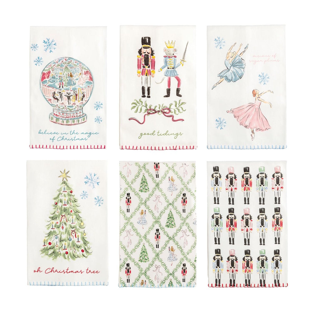 Set of six white Christmas dish towels featuring Nutcracker illustrations and stitched edge details.