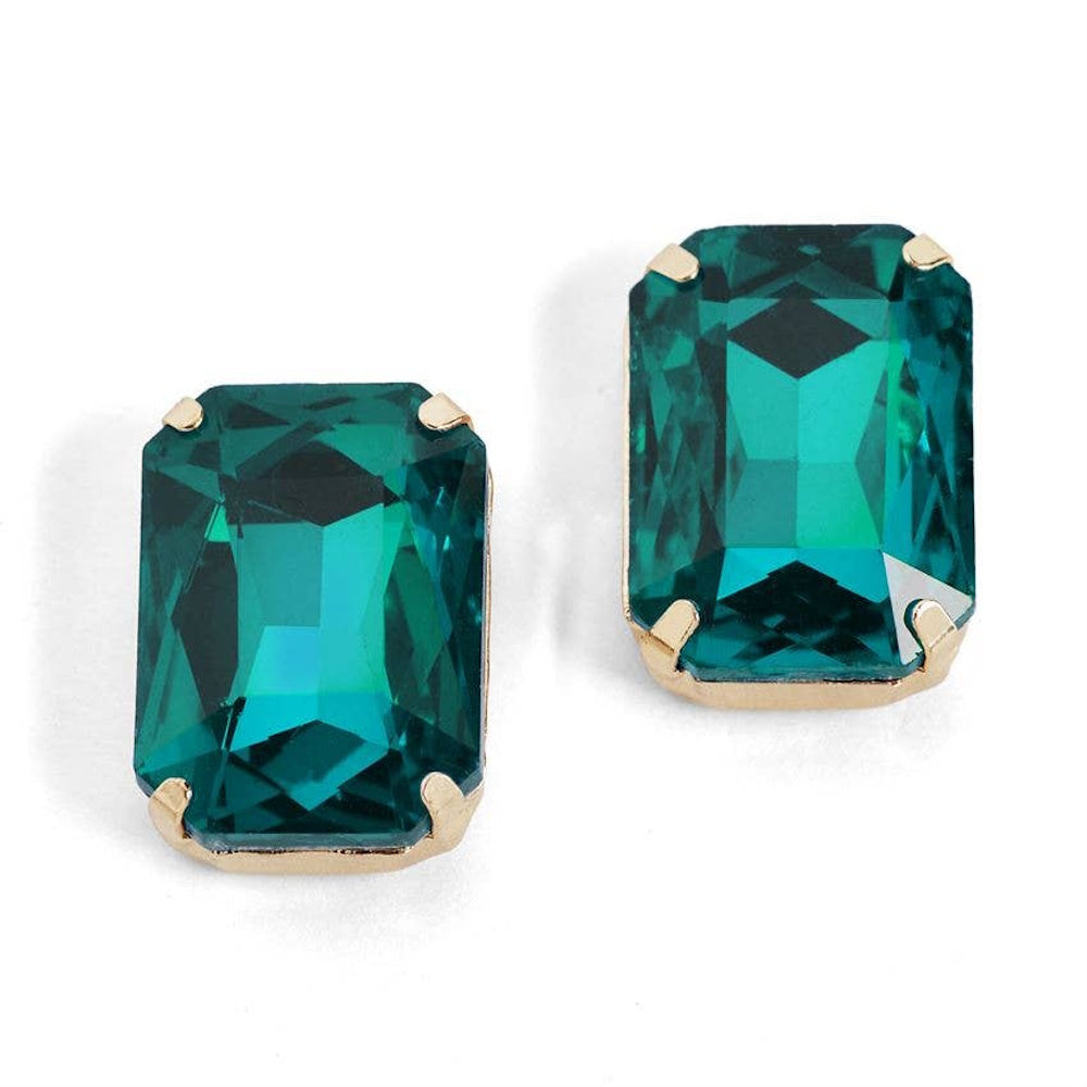 Emerald green emerald-cut jewel stud earrings with gold prongs on white background.