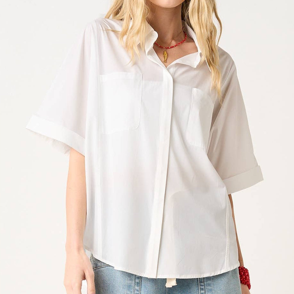 Off-white soft stretch woven short sleeve button-down shirt with chest pockets and cuffed sleeves for women.