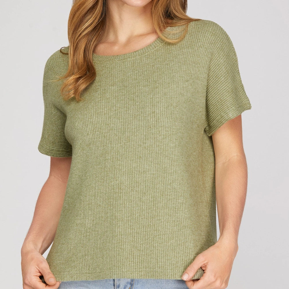 Olive green drop sleeve round neck knit top worn by a model with blonde hair.