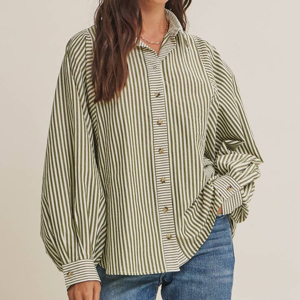 Oversized olive green and white striped button-down shirt with wide batwing sleeves and cuffed wrists.